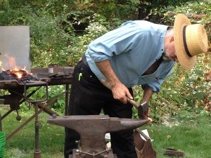 Live exhibit of a blacksmith at the Fall Harvest Festival 